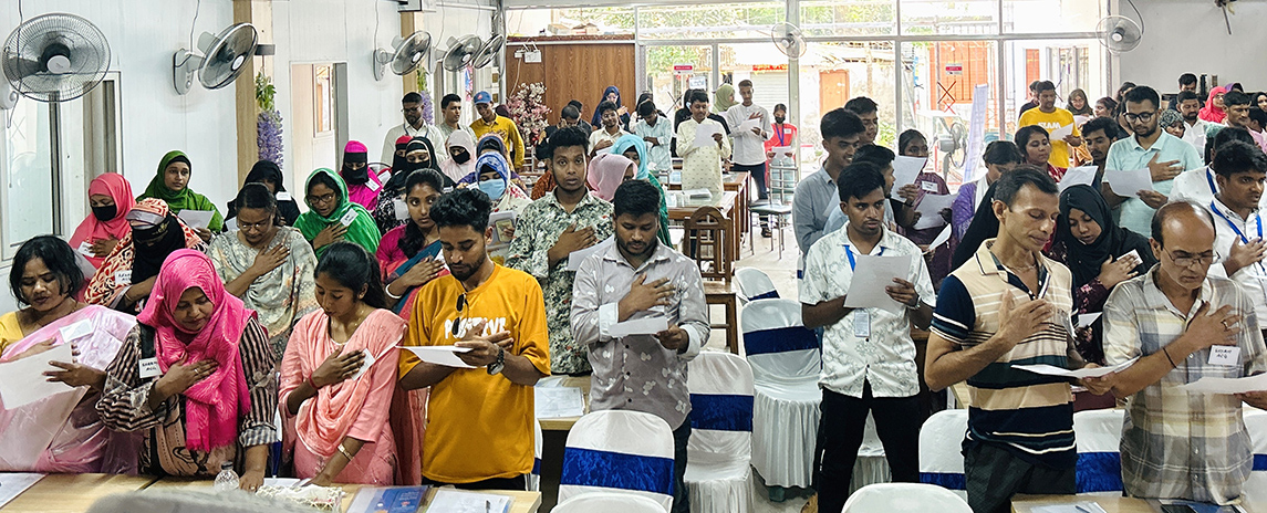 Participants attending a Learning Sharing Meeting in Pirojpur